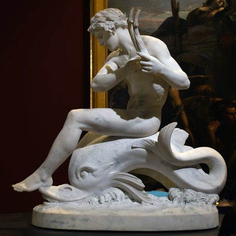 Arion sitting on the dolphin